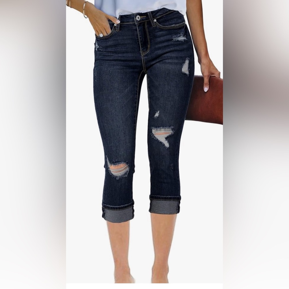 NWOT Capri jeans ripped. Dark blue, size 2XL. No tags but never worn.